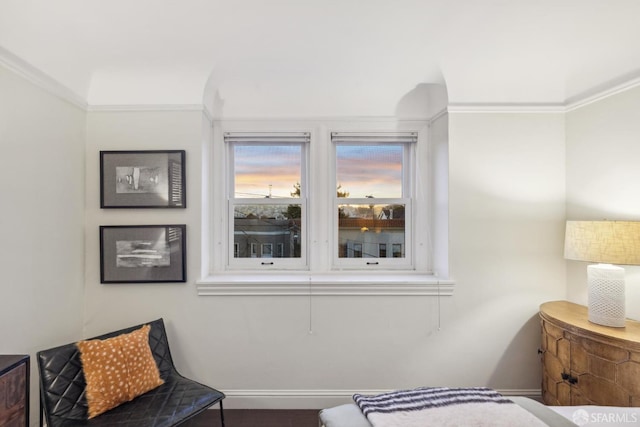 bedroom with ornamental molding and baseboards