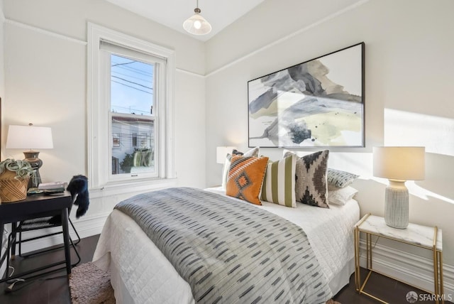 bedroom featuring wood finished floors