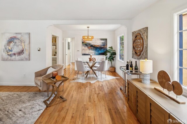 interior space with light wood-style floors and baseboards