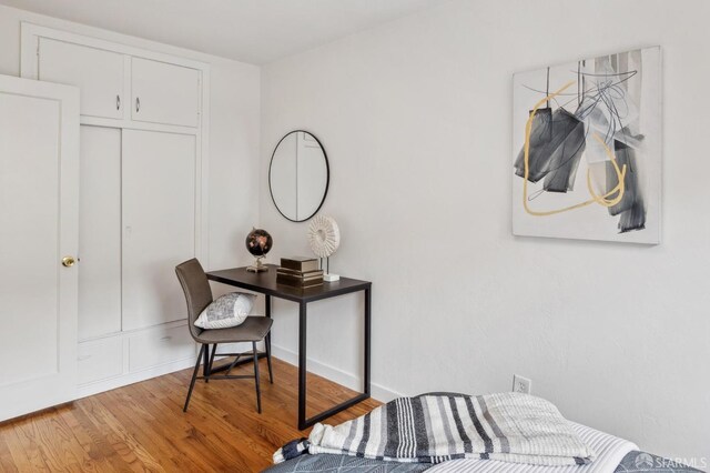 bedroom with wood finished floors
