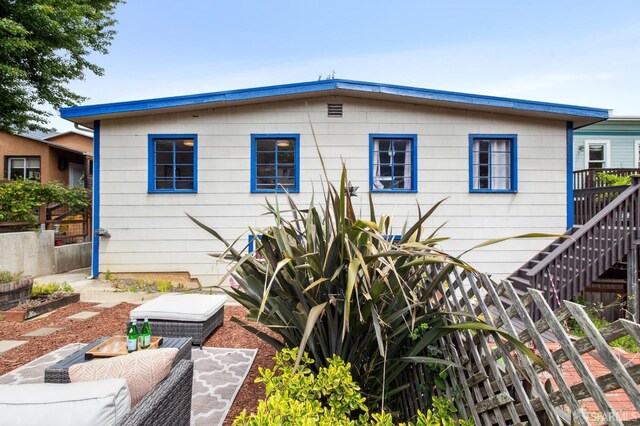 back of property with fence