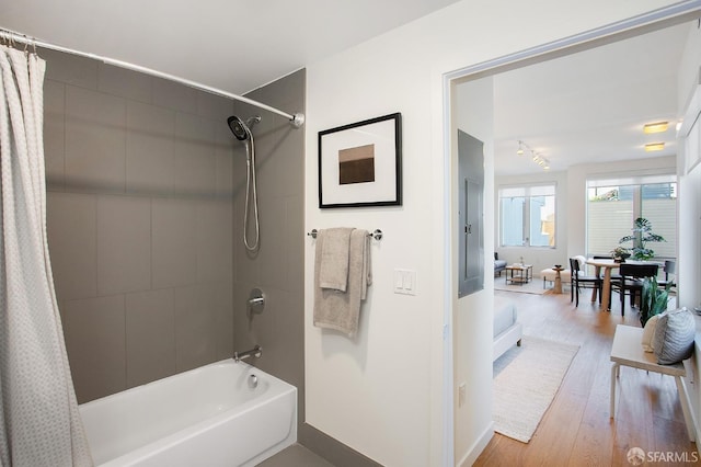 bathroom featuring shower / tub combo and hardwood / wood-style flooring