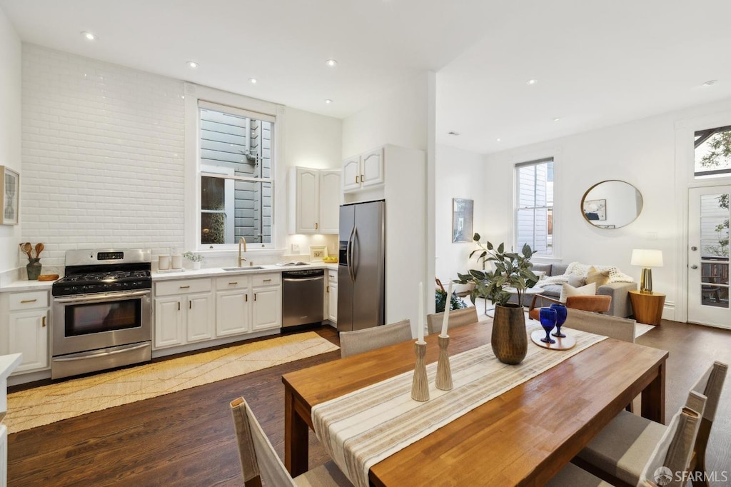 kitchen featuring appliances with stainless steel finishes, sink, and white cabinets