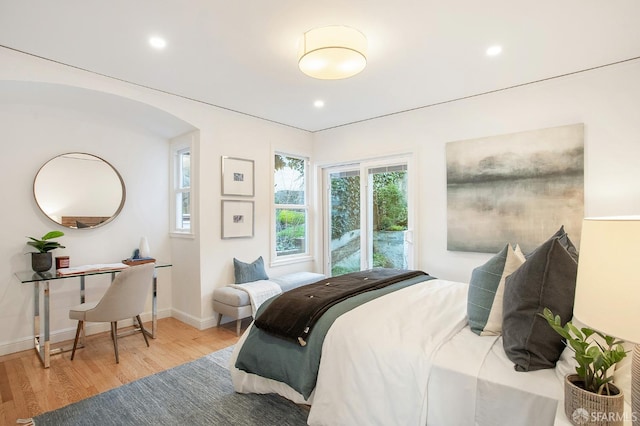 bedroom with hardwood / wood-style floors