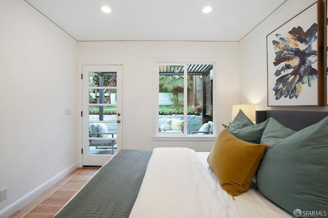 bedroom featuring light hardwood / wood-style flooring and access to exterior