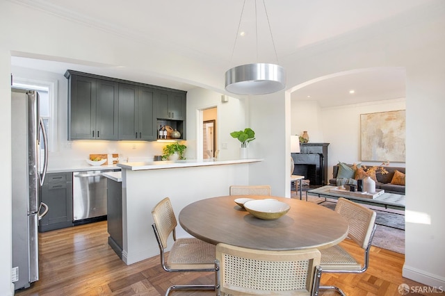 dining area featuring crown molding and parquet floors