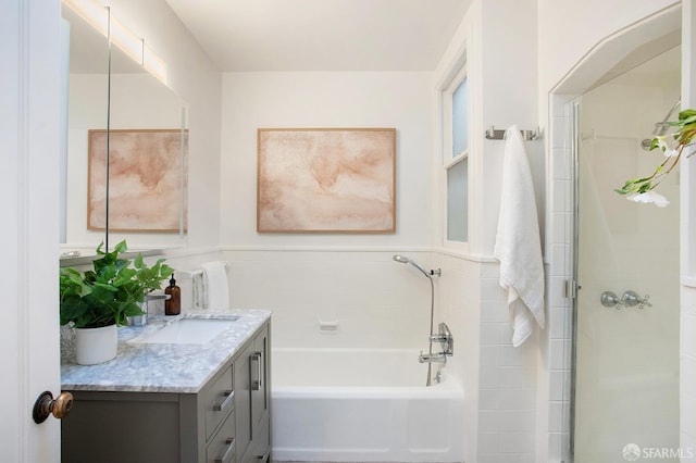 bathroom featuring independent shower and bath and vanity