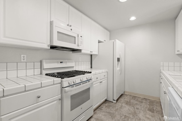 163 Stoneridge Ln, San Francisco, CA 94134 - kitchen featuring white appliances, tile countertops, white cabinetry, recessed lighting, and baseboards