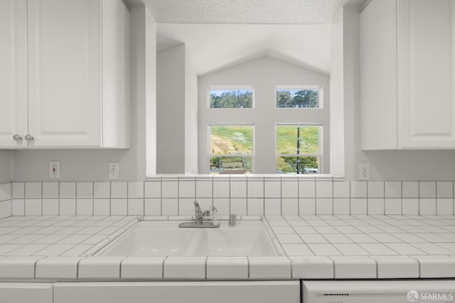 163 Stoneridge Ln, San Francisco, CA 94134 - kitchen view of a sink, tile countertops, and decorative backsplash