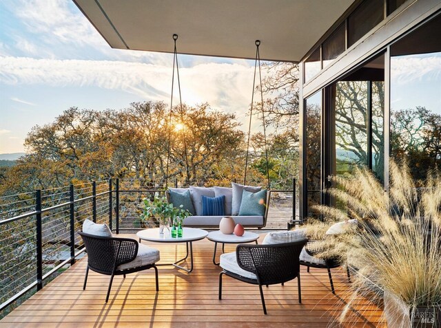 wooden deck with an outdoor hangout area