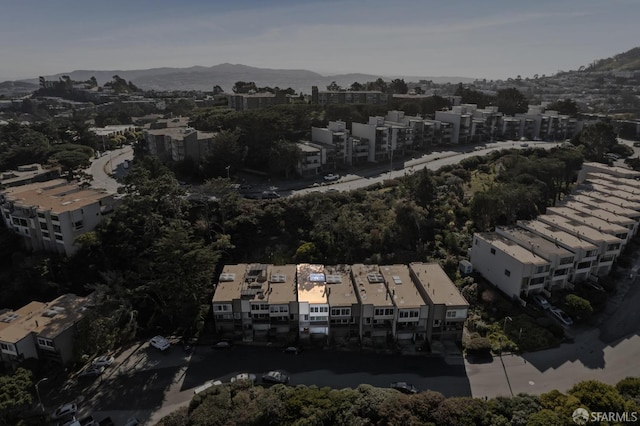 birds eye view of property featuring a mountain view