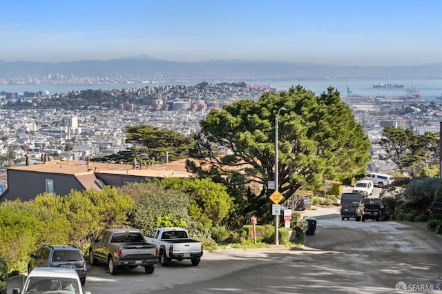 birds eye view of property featuring a water and mountain view