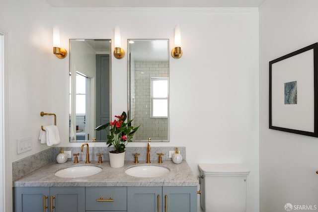 1347 Green St, San Francisco, CA 94109 - full bathroom with double vanity, toilet, healthy amount of natural light, and crown molding