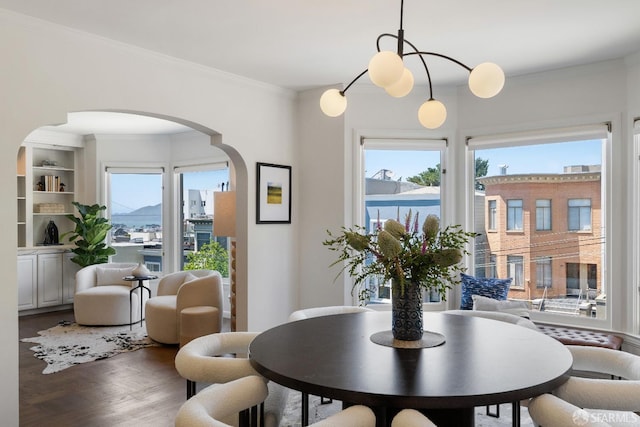 1347 Green St, San Francisco, CA 94109 - dining room with arched walkways, crown molding, and wood finished floors