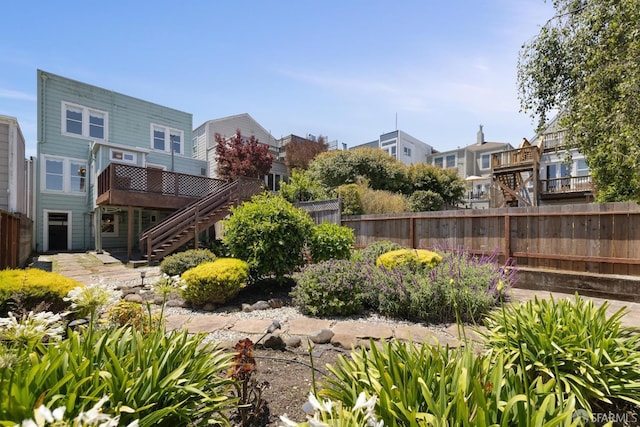 570 Jersey St, San Francisco, CA 94114 - view of yard with stairway, a residential view, and a wooden deck