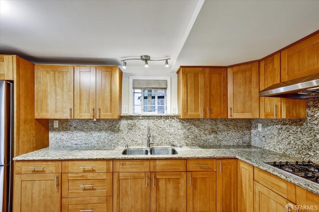 2486 26th Ave, Oakland, CA 94601 - kitchen with gas cooktop, decorative backsplash, light stone countertops, freestanding refrigerator, and extractor fan