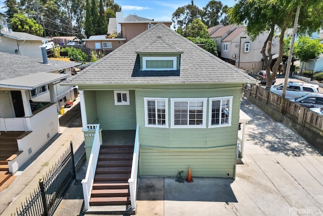 2486 26th Ave, Oakland, CA 94601 - rear view of property featuring a shingled roof and a residential view