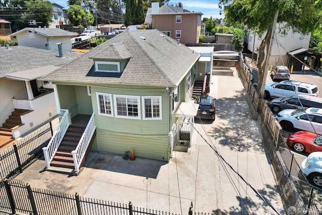 2486 26th Ave, Oakland, CA 94601 - back of property with stairway and roof with shingles