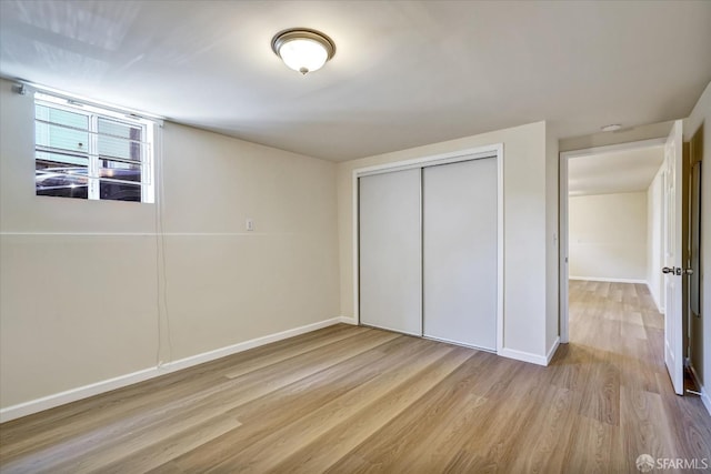 2486 26th Ave, Oakland, CA 94601 - unfurnished bedroom featuring wood finished floors and a closet