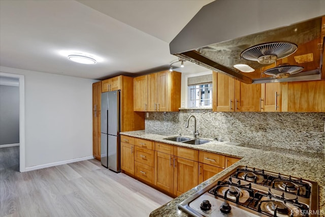 2486 26th Ave, Oakland, CA 94601 - kitchen with stainless steel appliances, light wood-style floors, tasteful backsplash, and light stone countertops