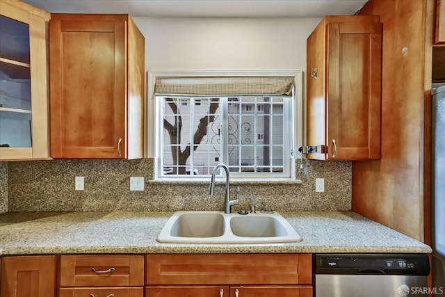 2486 26th Ave, Oakland, CA 94601 - kitchen featuring stainless steel dishwasher, tasteful backsplash, and brown cabinetry