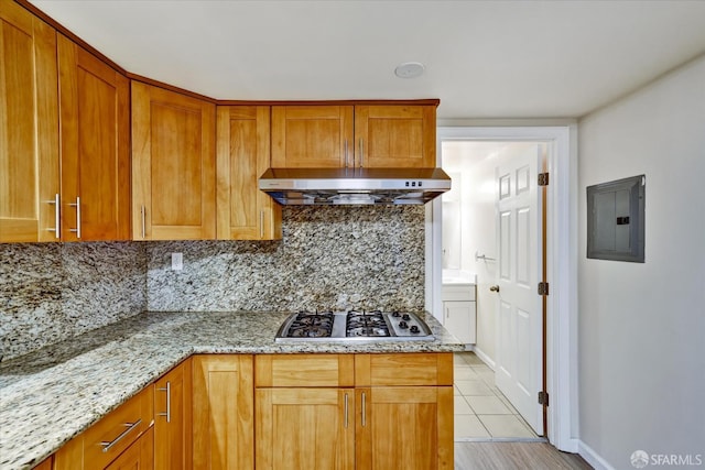 2486 26th Ave, Oakland, CA 94601 - kitchen with extractor fan, electric panel, stainless steel gas cooktop, tasteful backsplash, and light stone counters