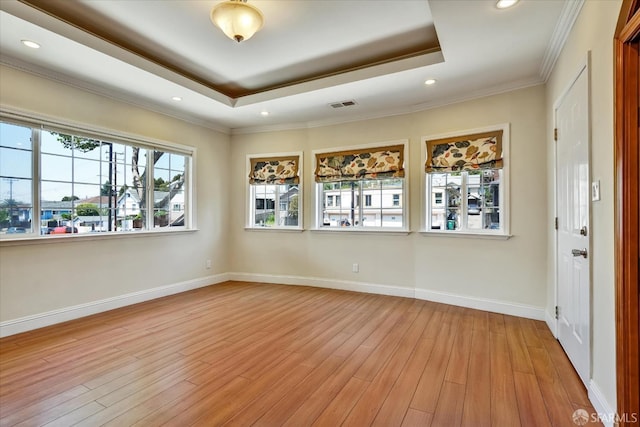 2486 26th Ave, Oakland, CA 94601 - unfurnished room with a raised ceiling, light wood-style flooring, recessed lighting, and crown molding