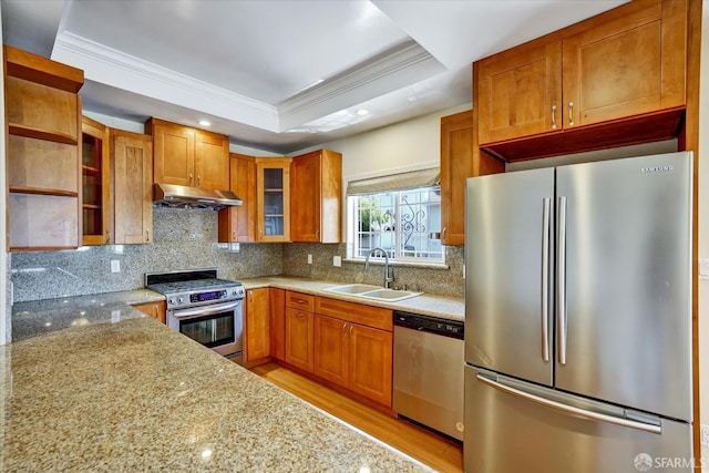 2486 26th Ave, Oakland, CA 94601 - kitchen featuring appliances with stainless steel finishes, range hood, ornamental molding, light wood-type flooring, and a raised ceiling