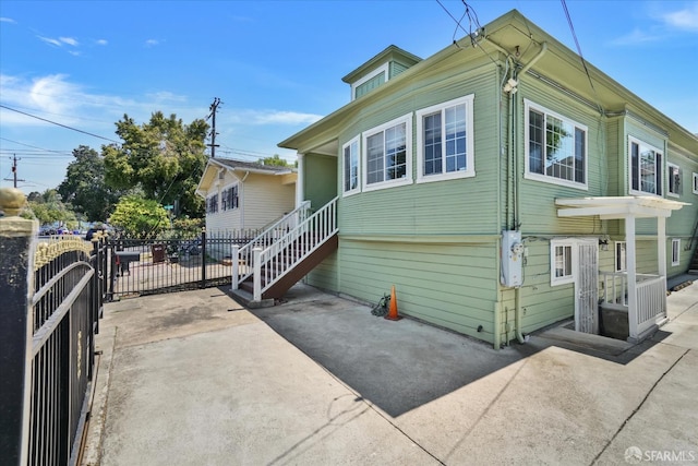 2486 26th Ave, Oakland, CA 94601 - view of property exterior with a patio and driveway