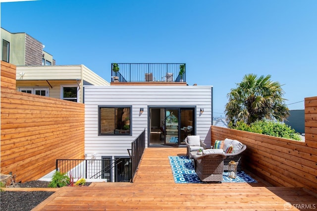 wooden deck featuring outdoor lounge area