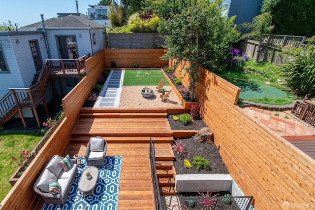 exterior space featuring a wooden deck and outdoor lounge area