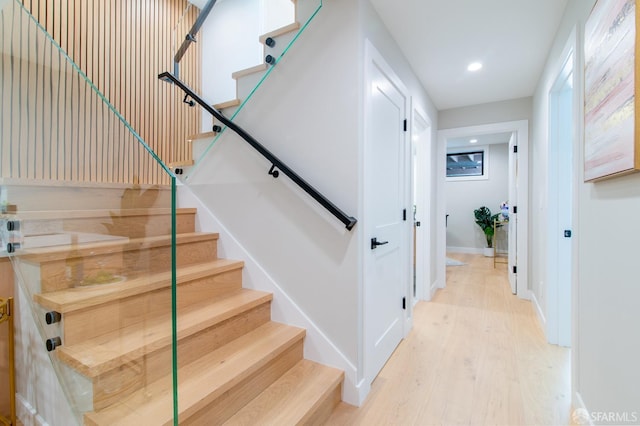 stairs with wood-type flooring