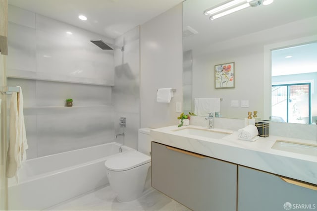 full bathroom featuring toilet, vanity, and bathtub / shower combination