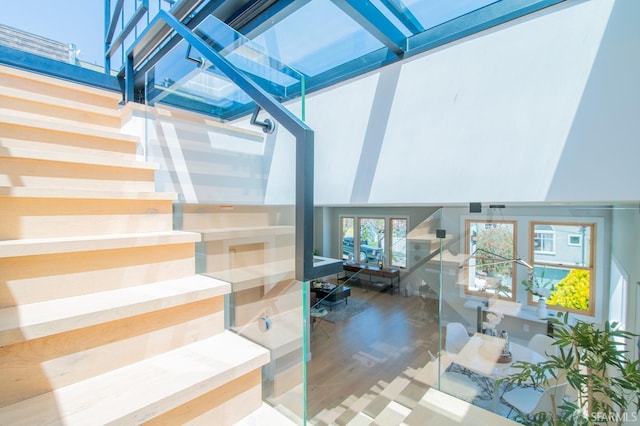 stairs featuring a skylight