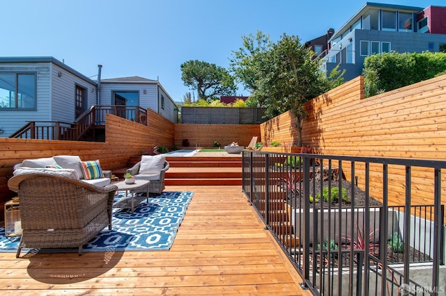 deck featuring outdoor lounge area