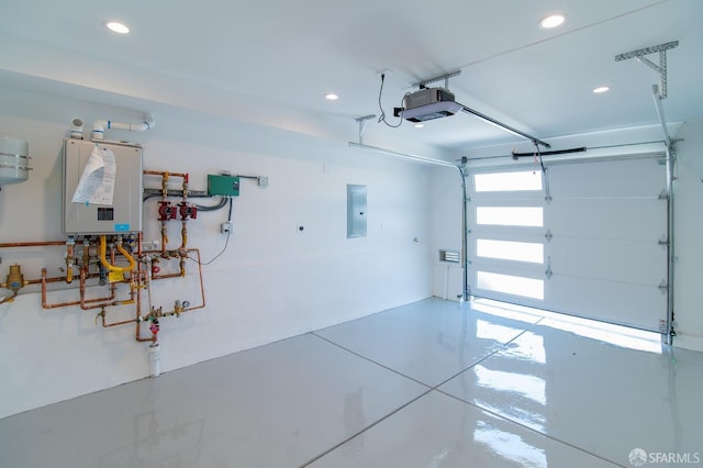 garage featuring a garage door opener, electric panel, and tankless water heater