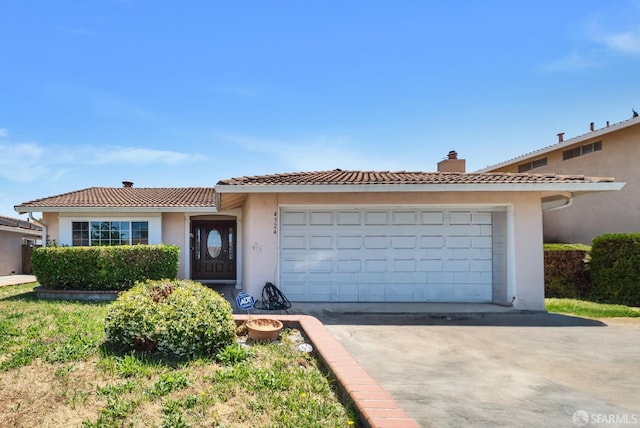 4324 Ellen Way, Union City, CA 94587 - view of front of home with a chimney, driveway, a tiled roof, stucco siding, and a garage