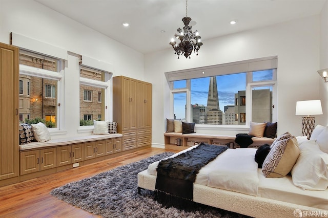 850 Powell St Unit 104, San Francisco, CA 94108 - bedroom featuring light wood-style floors, a chandelier, and recessed lighting