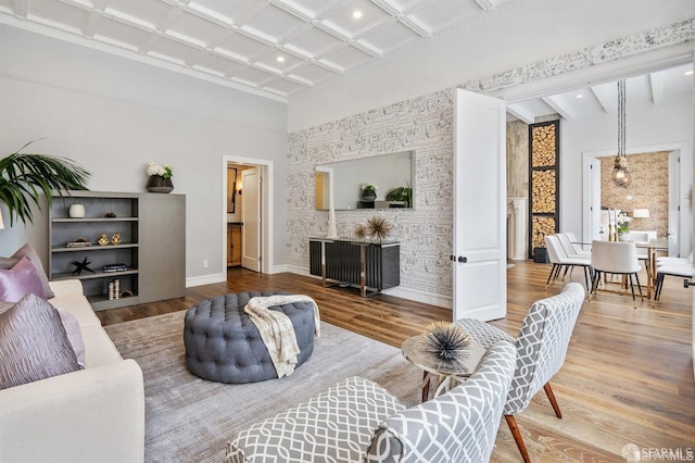 850 Powell St Unit 104, San Francisco, CA 94108 - living area featuring coffered ceiling, baseboards, beam ceiling, wood finished floors, and a high ceiling