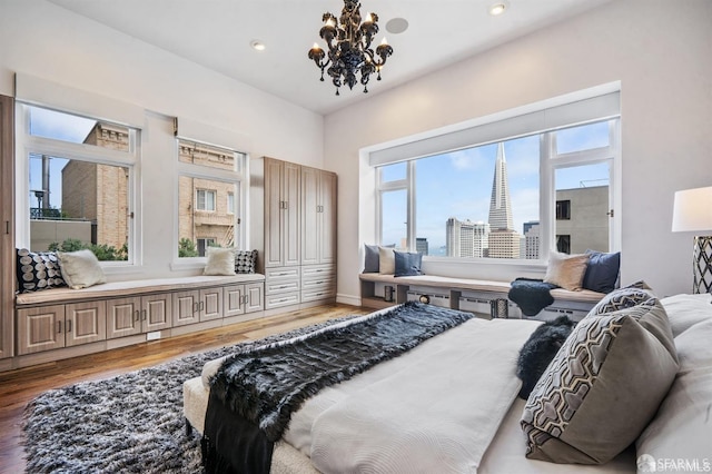 850 Powell St Unit 104, San Francisco, CA 94108 - bedroom featuring wood finished floors, a chandelier, and recessed lighting