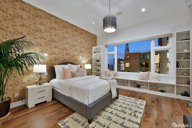 850 Powell St Unit 104, San Francisco, CA 94108 - bedroom with wallpapered walls, wood finished floors, and baseboards