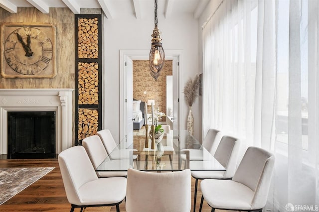 850 Powell St Unit 104, San Francisco, CA 94108 - dining space with wood finished floors, beamed ceiling, and a fireplace