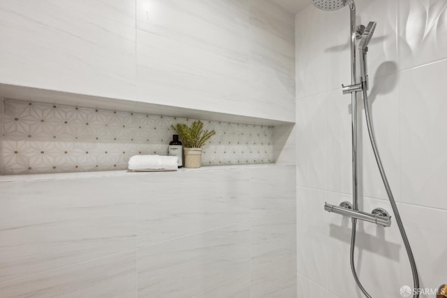 bathroom view of tiled shower