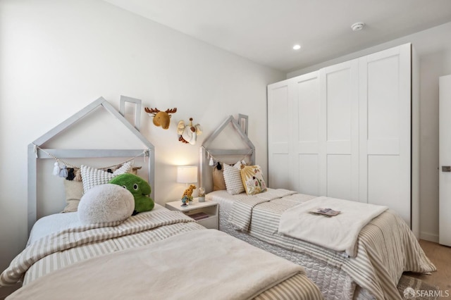 carpeted bedroom with recessed lighting