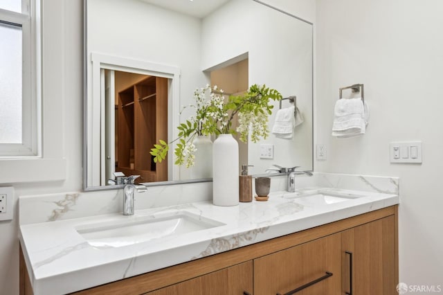 bathroom featuring double vanity