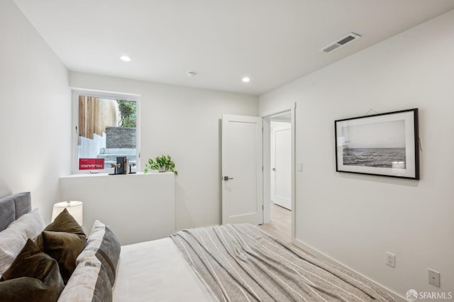 bedroom with recessed lighting and baseboards