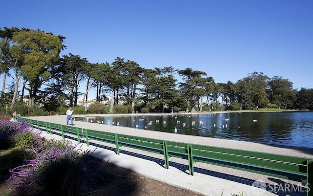 view of home's community with a water view