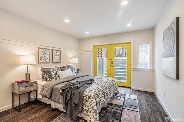 bedroom featuring access to exterior, dark hardwood / wood-style flooring, and french doors