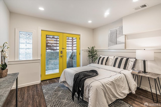 bedroom with dark wood-type flooring, access to outside, and french doors