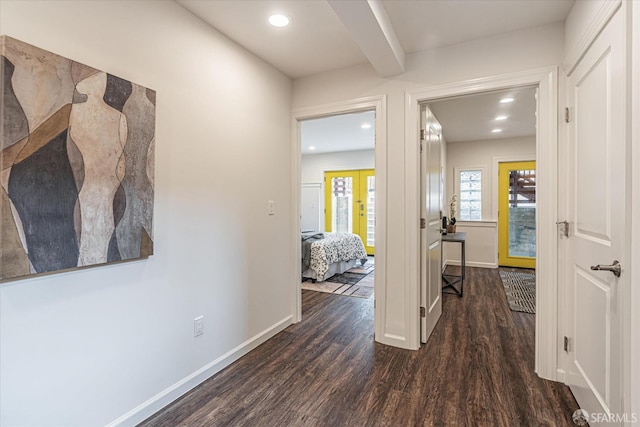 hallway with dark wood-type flooring and french doors